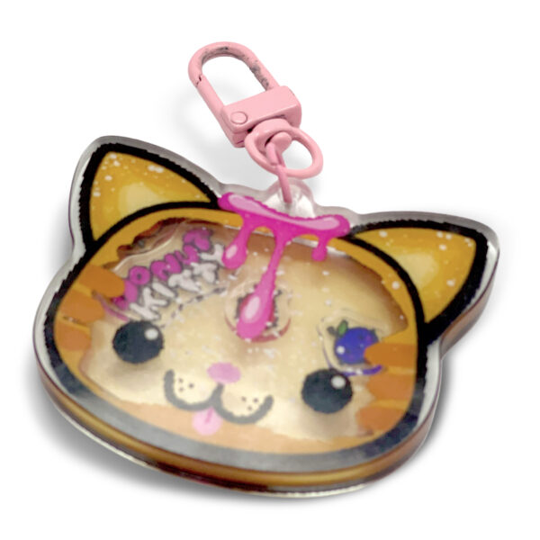 Donut Kitty shaker keychain with floating fruit characters inside layered acrylic design